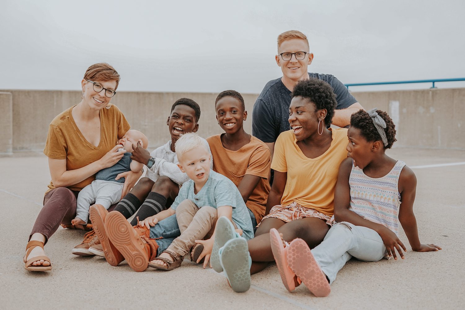 People sitting on the ground laughing